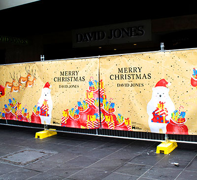 Merry Christmas Banner Mesh on Temporary Fencing front of David Jones